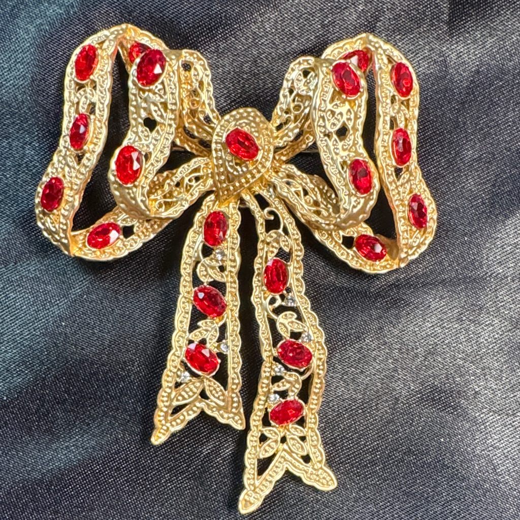 Gold-Tone Bow Brooch With Red Crystal Accents 9$
